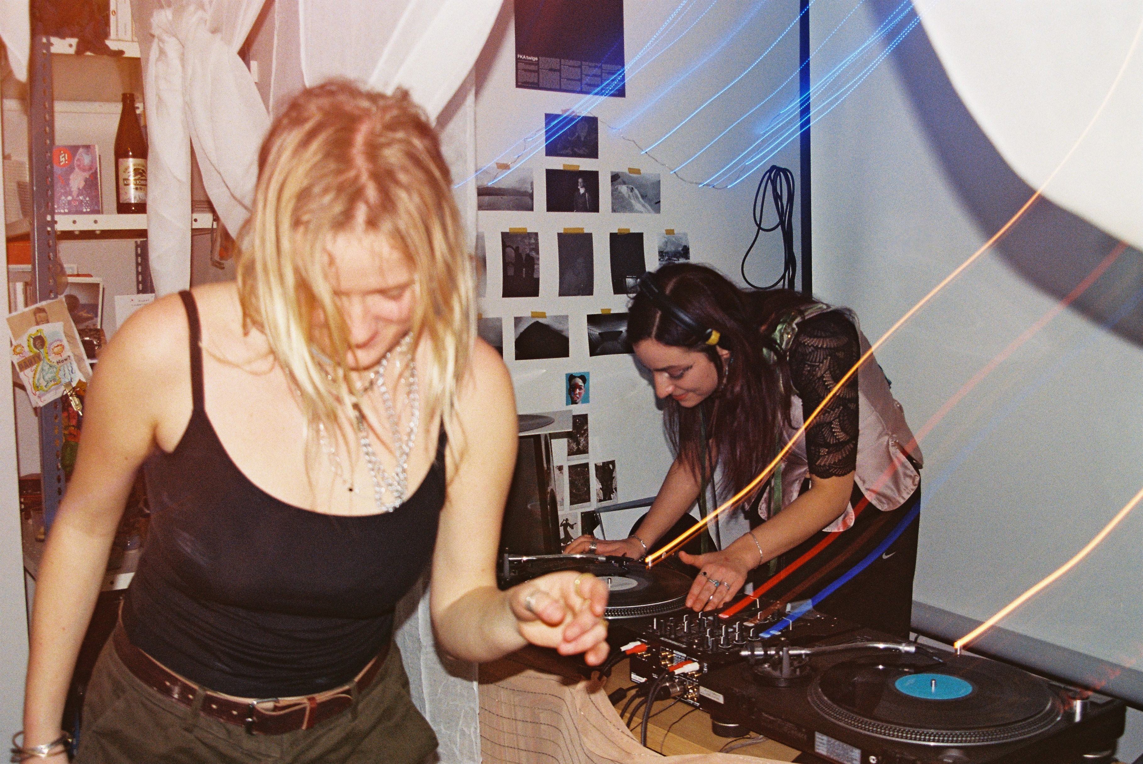 Olivia is dancing and Gemma is DJing