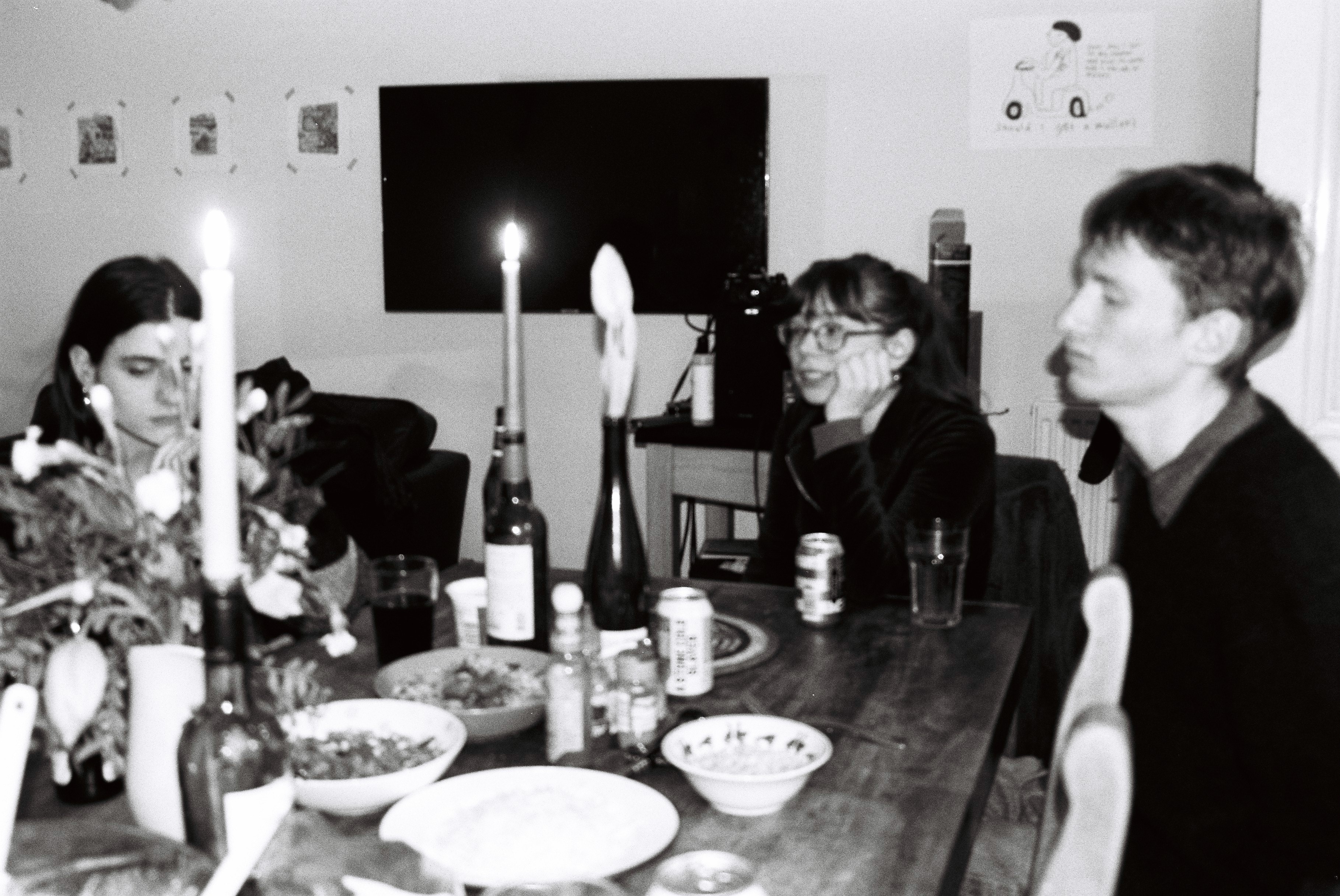 Three friends eating dinner at a table