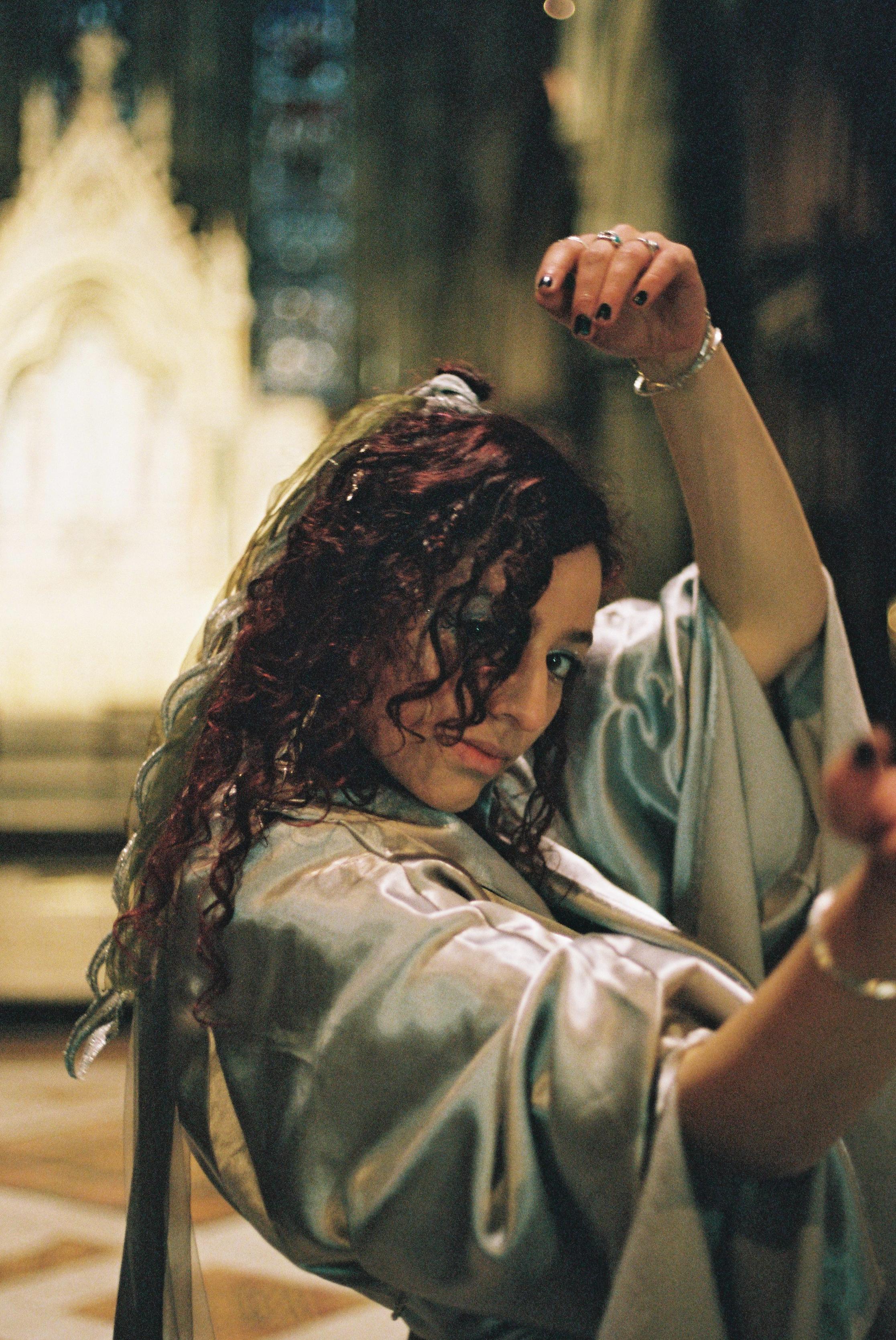 close up of alliyah dancing in cathedral