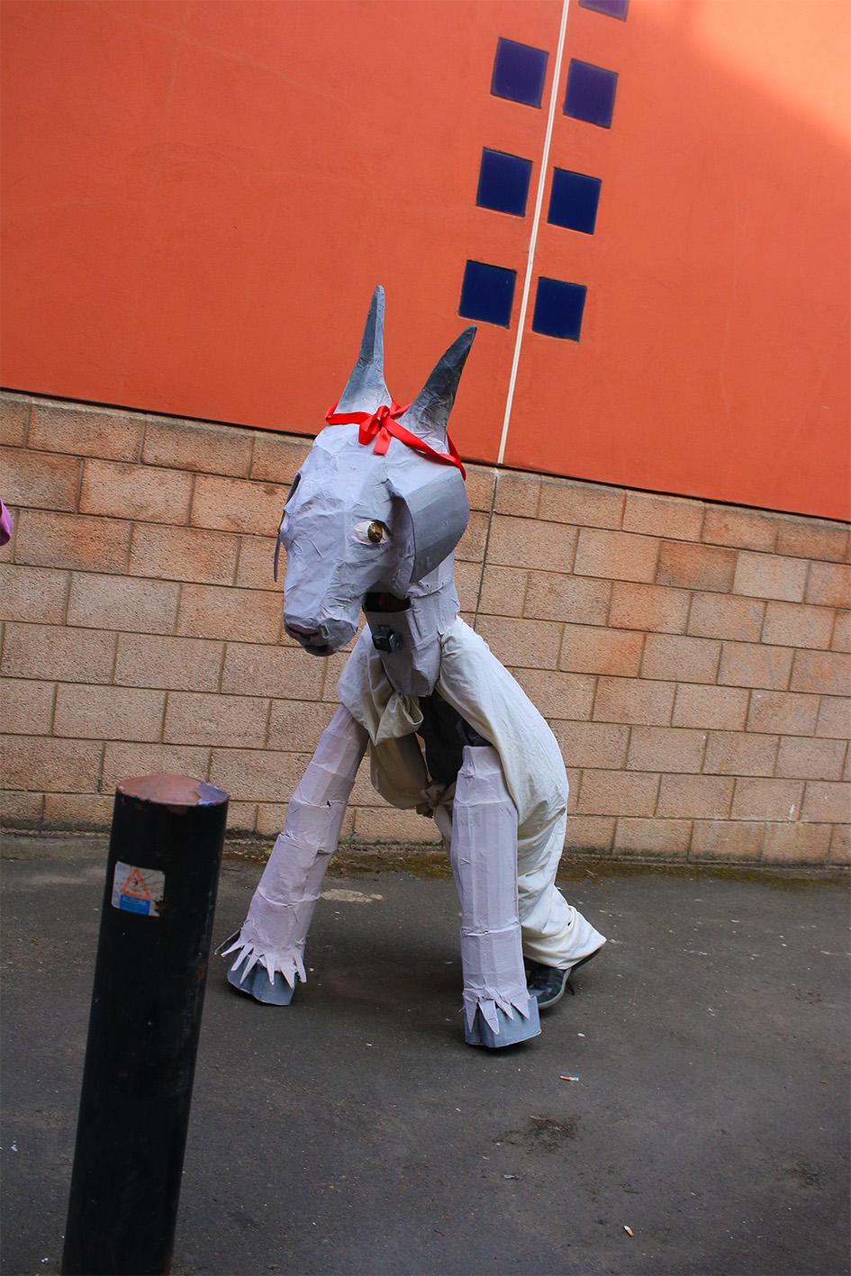 Figure in papier-mâché goat costume