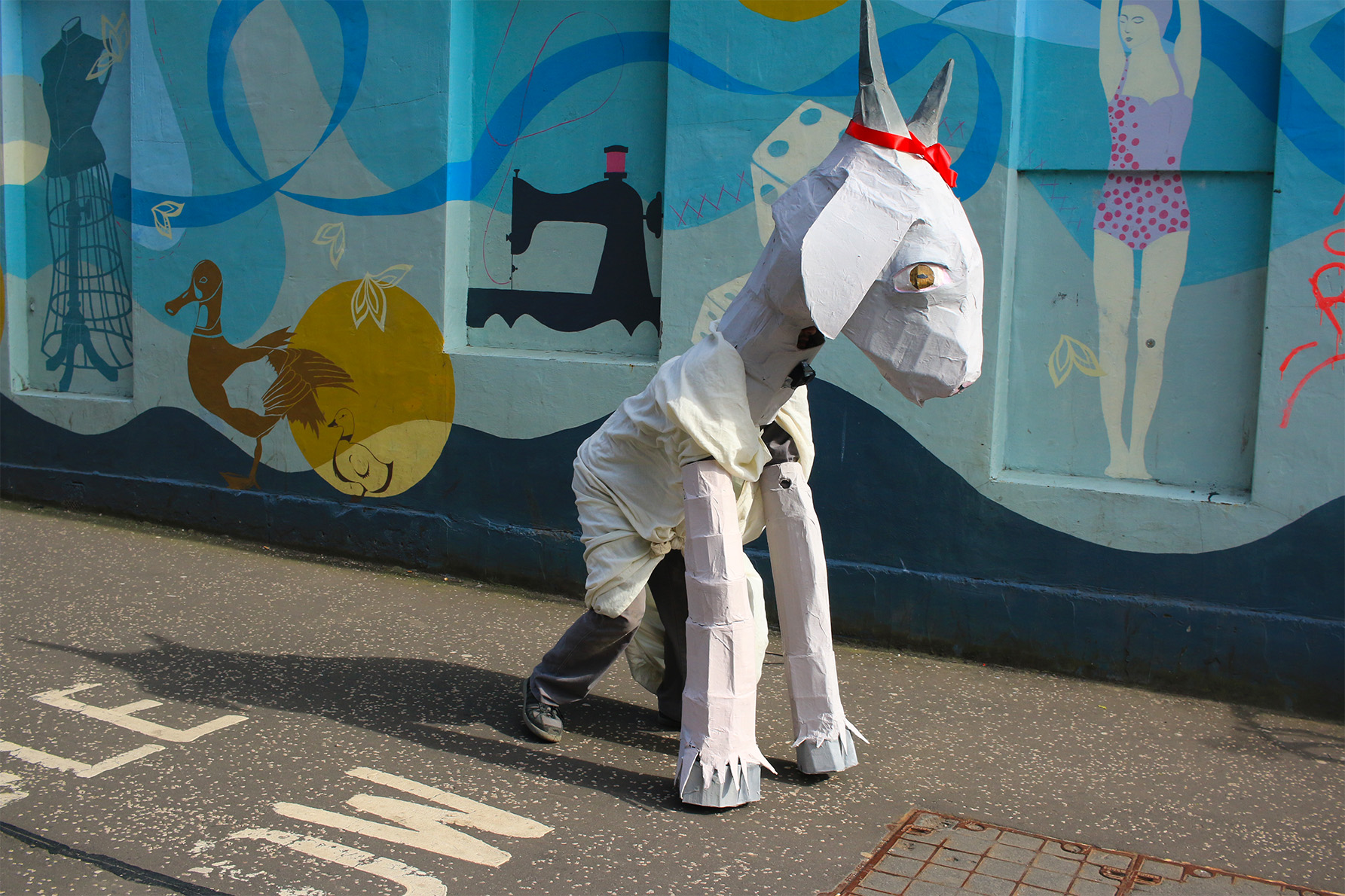 Figure in papier-mâché goat costume